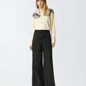 Pantalones ligeros con cordones y detalles texanos