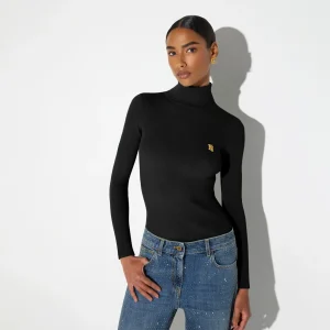Jersey de cuello alto de punto con bordados a jour
