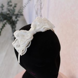 Diadema de niña con lazada de pedrería
