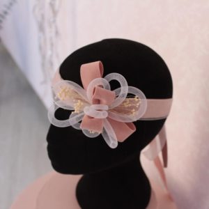 Tocado de niña con lazada rosa